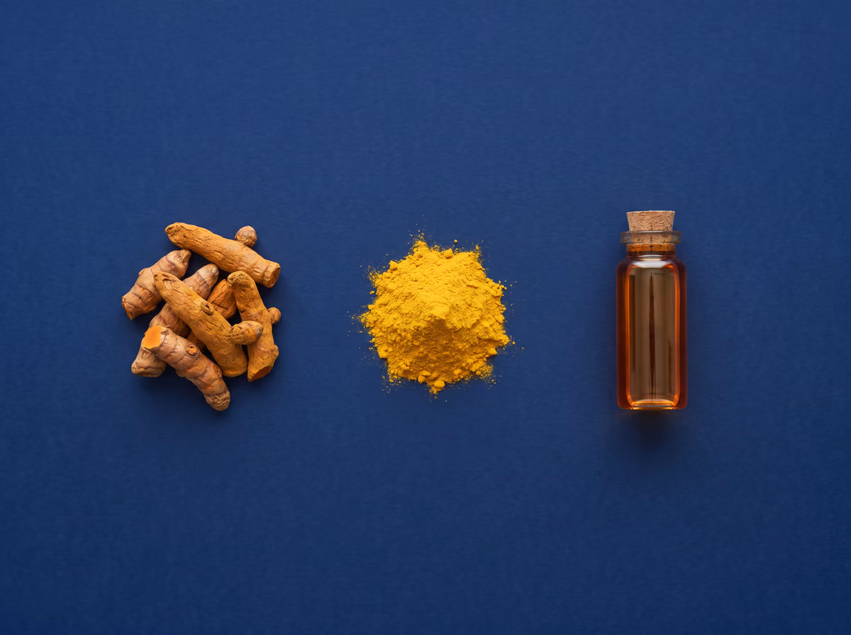 Dried turmeric fingers, turmeric powder and a vial of turmeric oleoresin